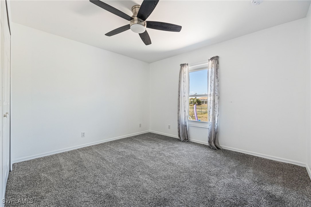 217 Manatee Street Fort Myers, FL 33913 - Photo 22 of 39 an empty room with a window and a fan