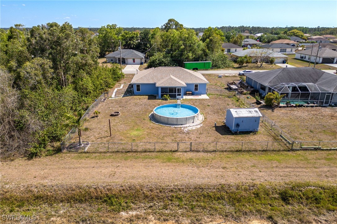 217 Manatee Street Fort Myers, FL 33913 - Photo 37 of 39 a view of a house with pool and chairs