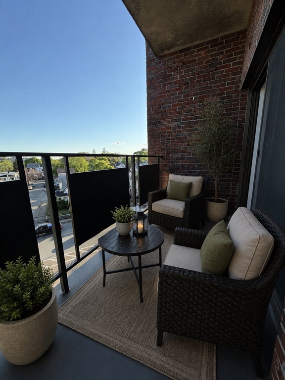 2 Victory Road, Unit 38 Lynn, MA 01902 - Photo 7 of 10 a living room with furniture and a potted plant