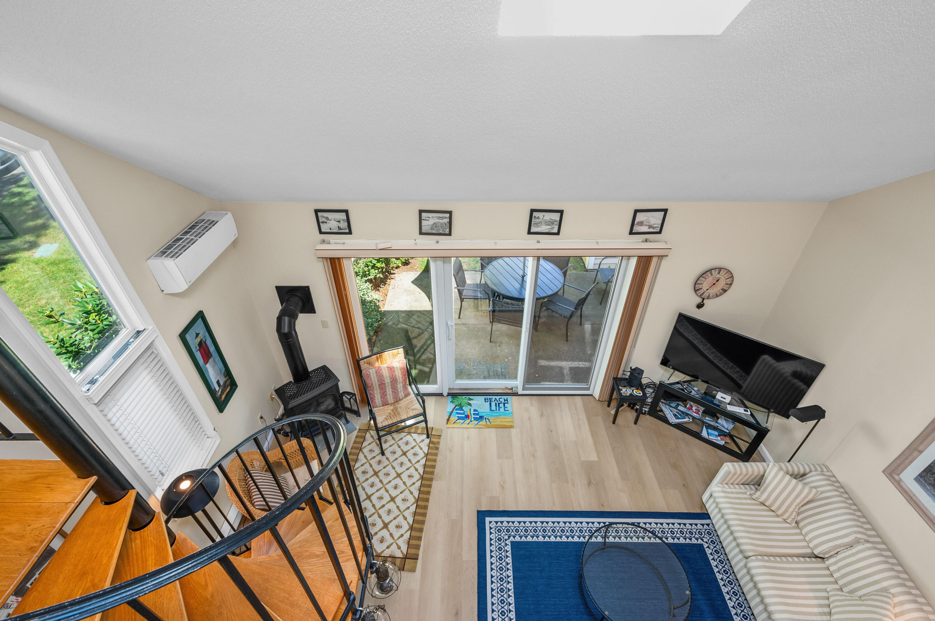 1 Howland Circle Brewster, MA 02631 - Photo 13 of 29 a view of a livingroom with furniture wooden floor and windows