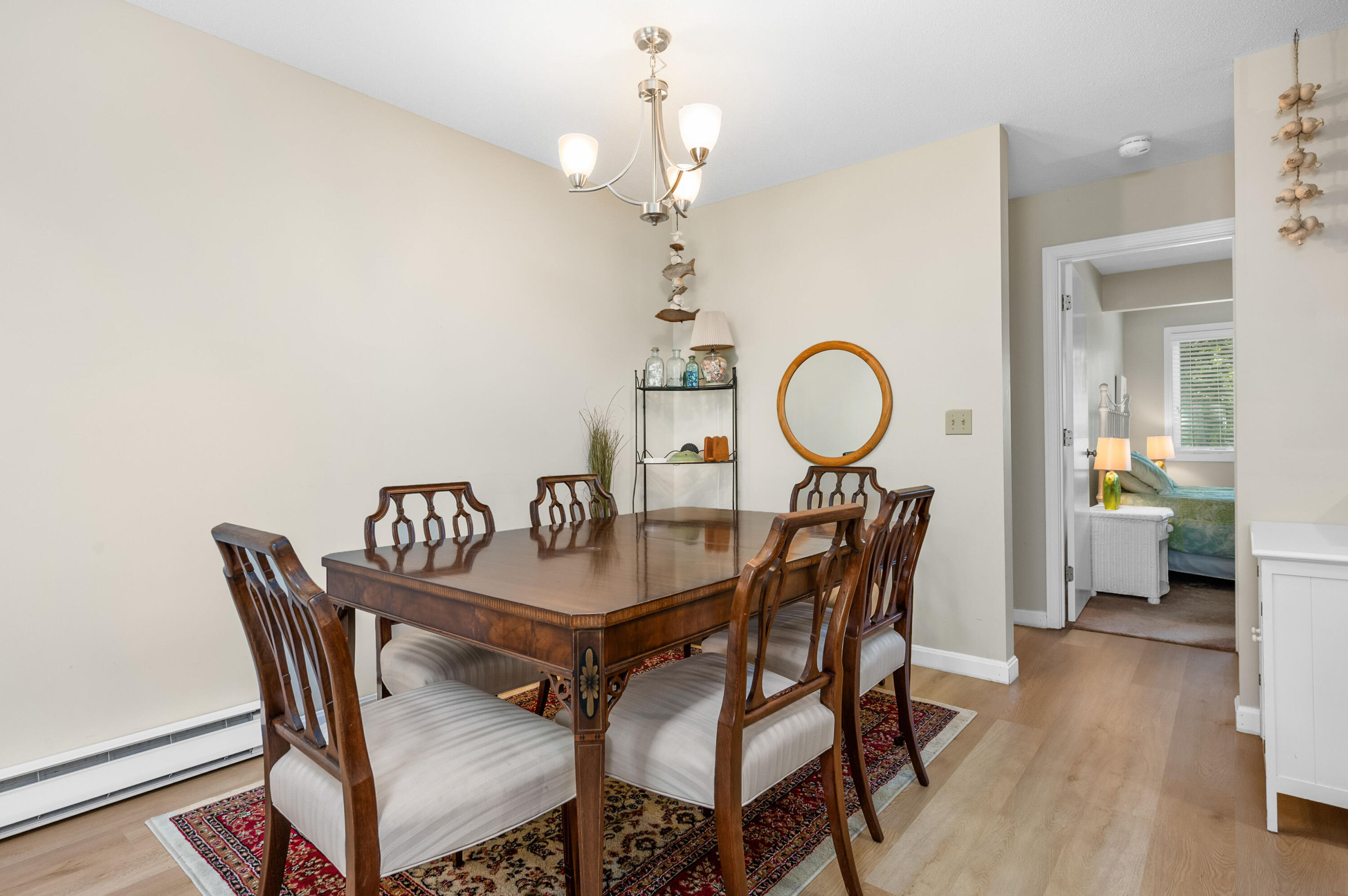 1 Howland Circle Brewster, MA 02631 - Photo 14 of 29 a dining room with furniture and wooden floor