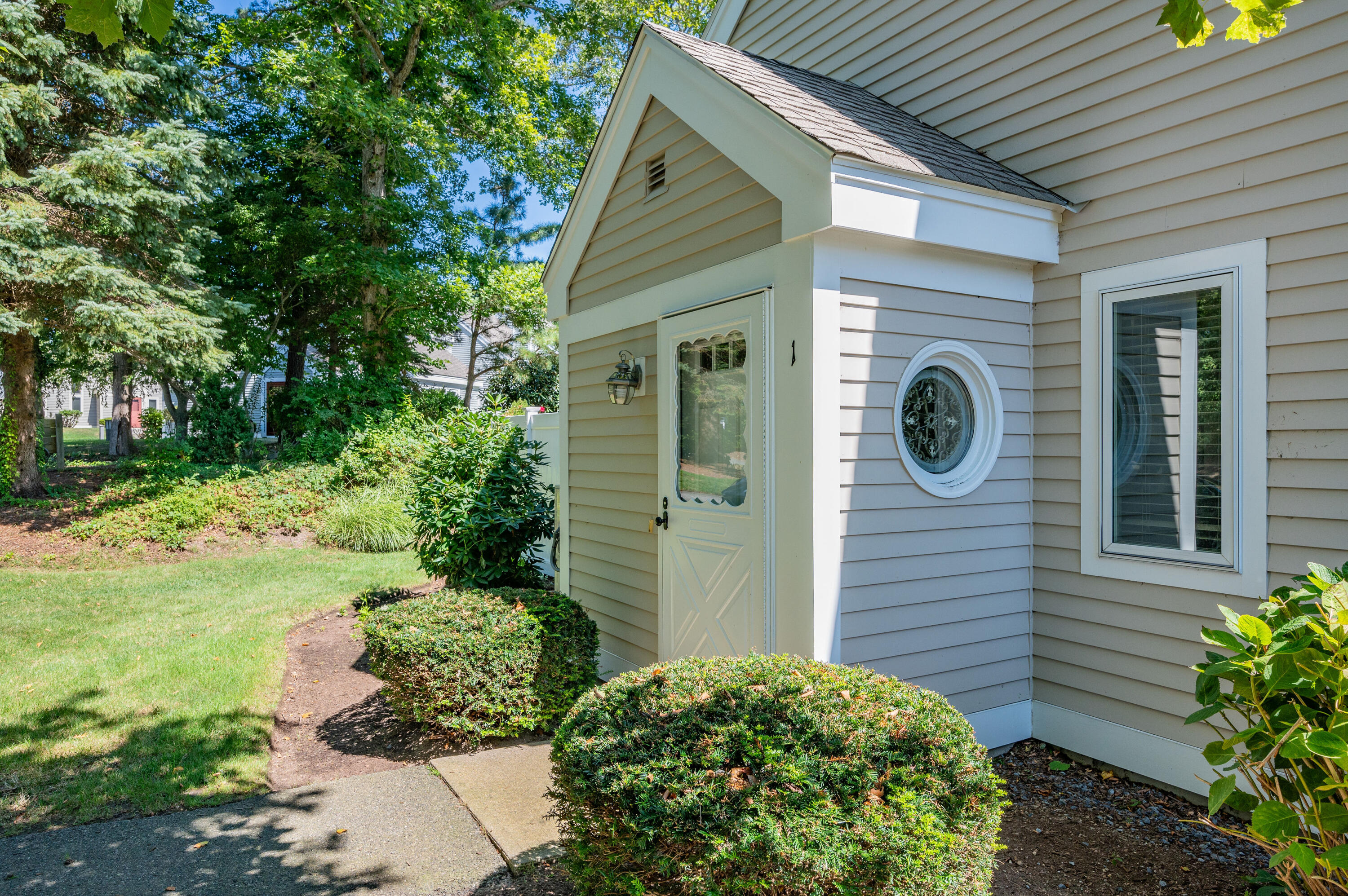 1 Howland Circle Brewster, MA 02631 - Photo 3 of 29 a view of a back yard of the house