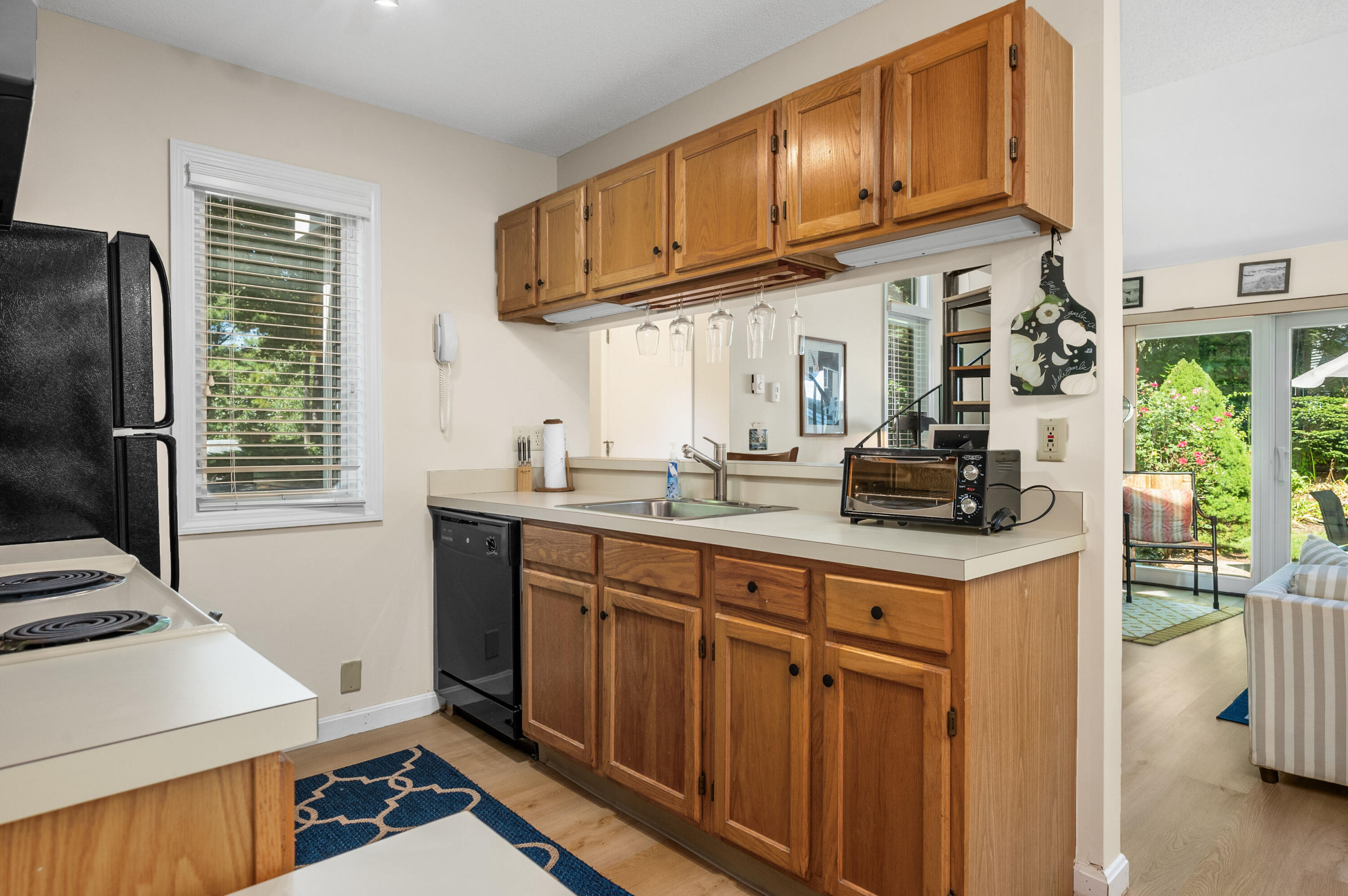 1 Howland Circle Brewster, MA 02631 - Photo 5 of 29 a kitchen with stainless steel appliances granite countertop a sink stove and cabinets