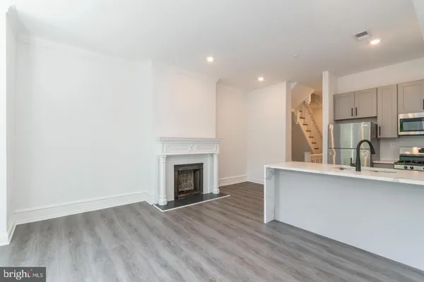 a view of kitchen with wooden floor