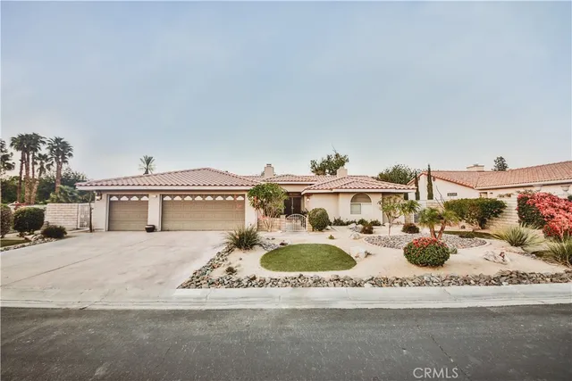 a kitchen with a table and chairs