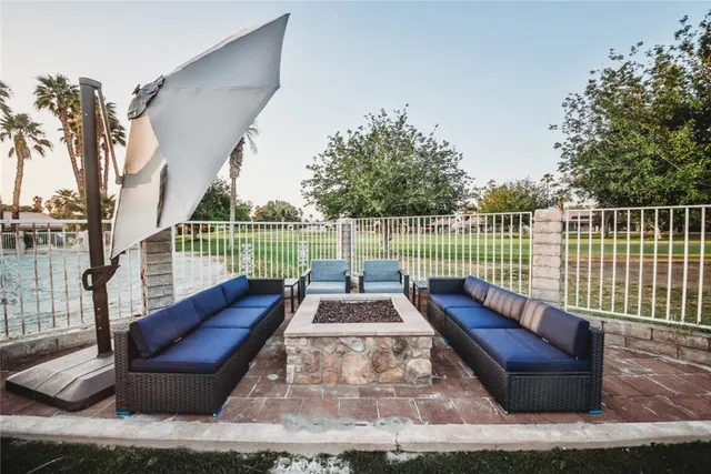 a view of balcony with couch and wooden fence