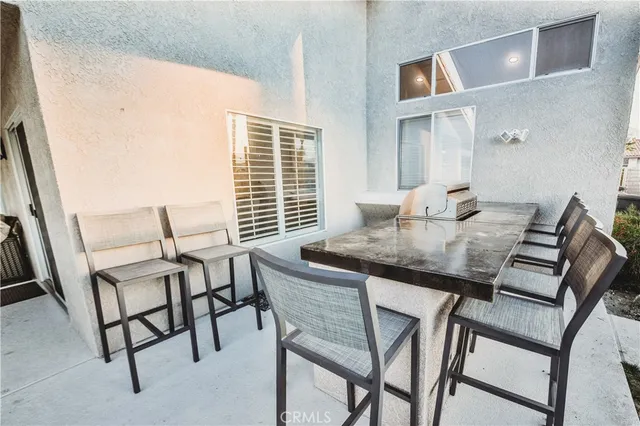 a view of a dining room with furniture and window