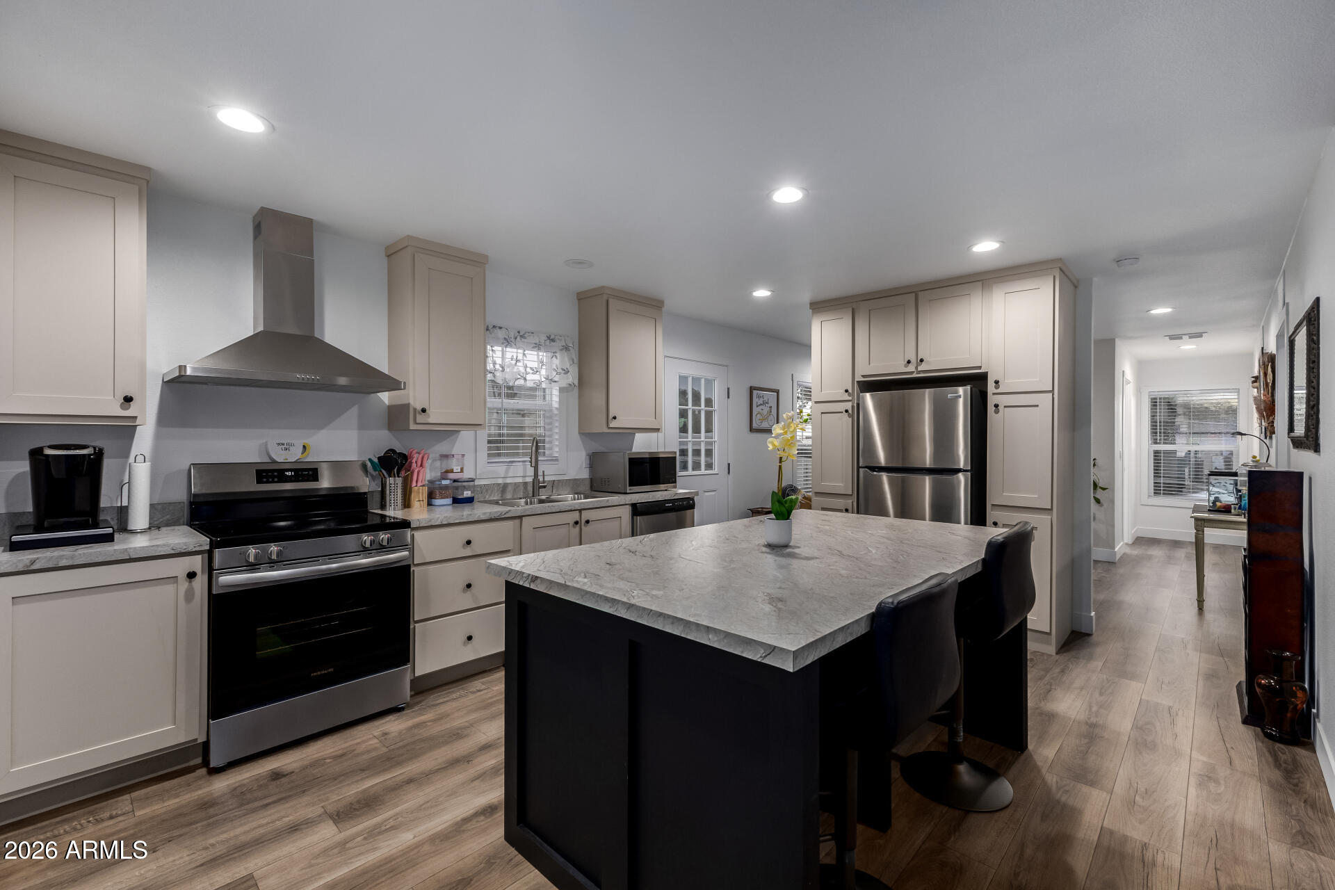 19401 North 7th Street, Unit 73 Phoenix, AZ 85024 - Photo 13 of 30 a kitchen with a stove a sink and a refrigerator