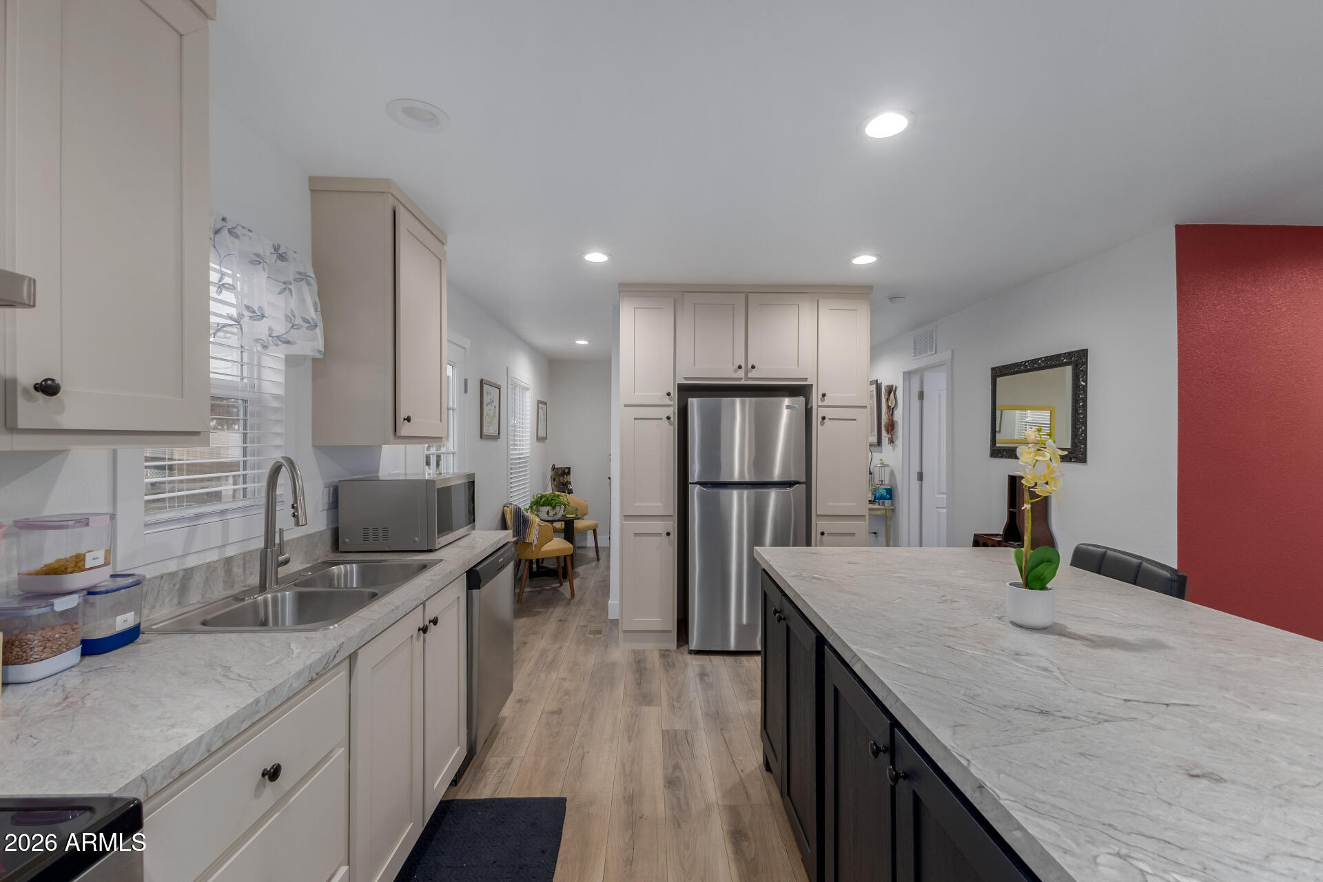 19401 North 7th Street, Unit 73 Phoenix, AZ 85024 - Photo 16 of 30 a kitchen with counter top space cabinets and stainless steel appliances