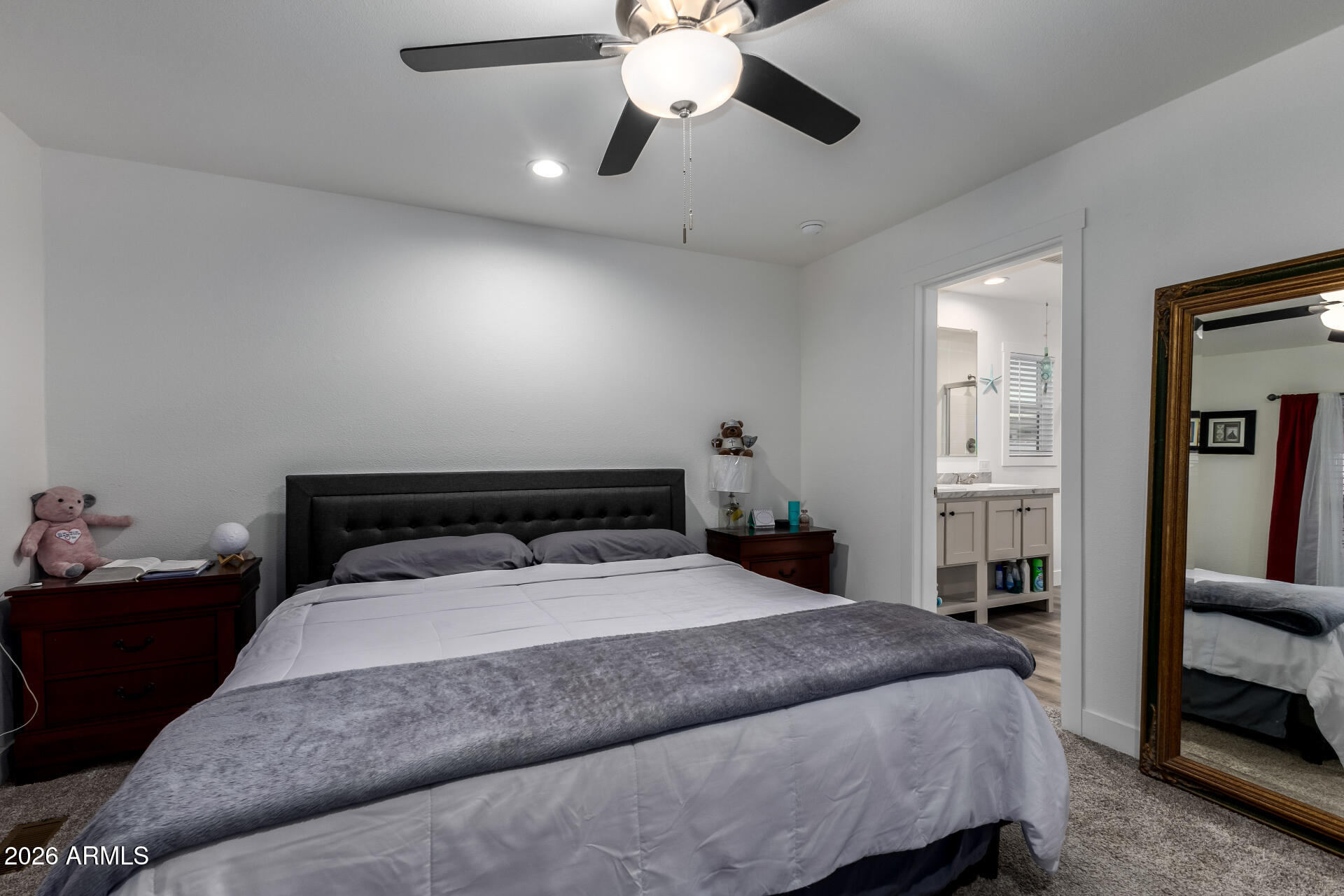 19401 North 7th Street, Unit 73 Phoenix, AZ 85024 - Photo 18 of 30 a bed sitting in a bedroom and chandelier