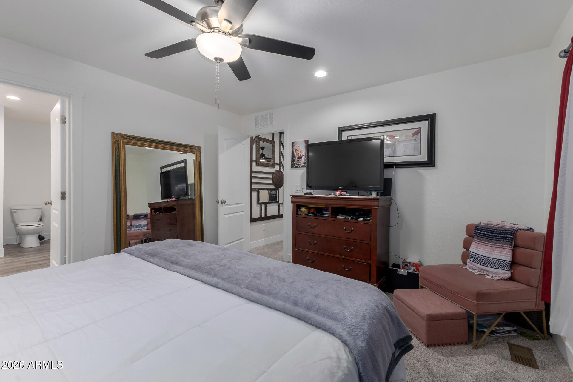 19401 North 7th Street, Unit 73 Phoenix, AZ 85024 - Photo 19 of 30 a bedroom with a bed and a flat screen tv