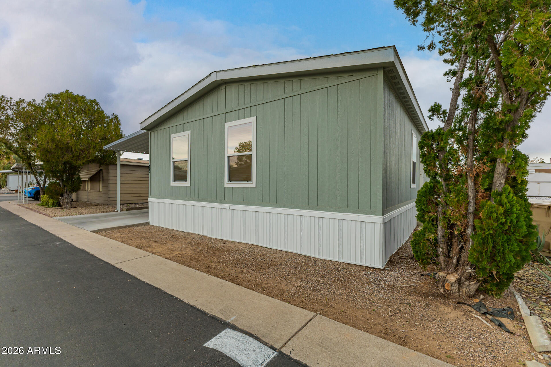 19401 North 7th Street, Unit 73 Phoenix, AZ 85024 - Photo 2 of 30 a house with trees in front of it