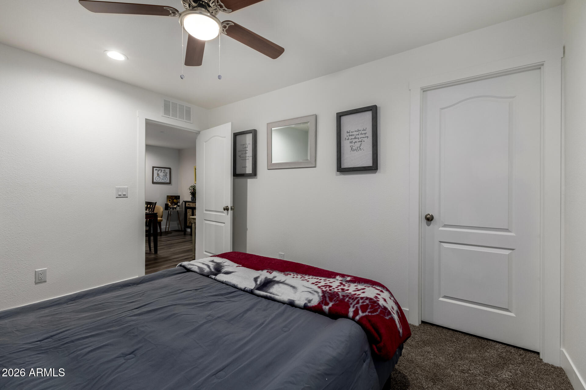 19401 North 7th Street, Unit 73 Phoenix, AZ 85024 - Photo 24 of 30 a bedroom with a bed and a ceiling fan