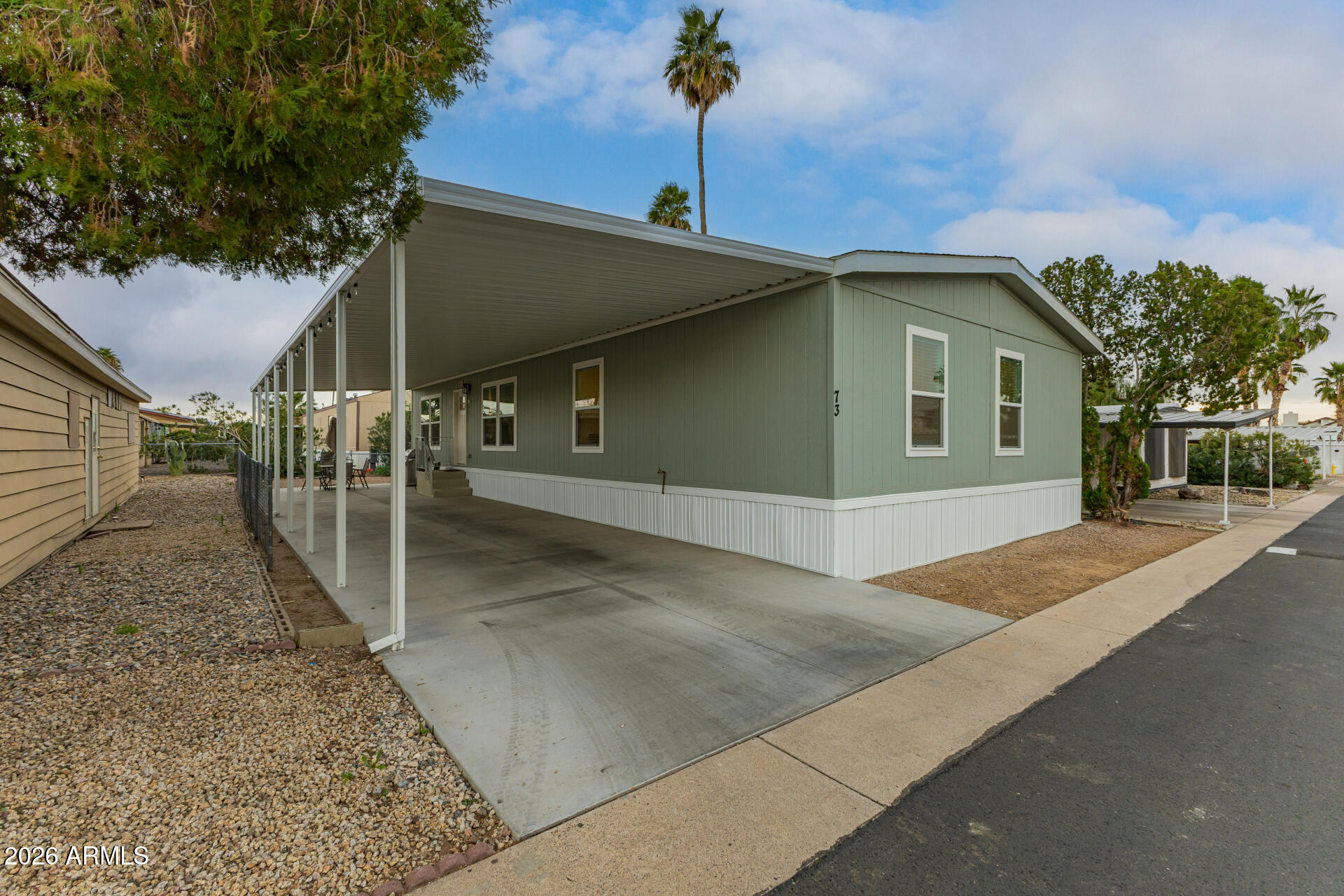 19401 North 7th Street, Unit 73 Phoenix, AZ 85024 - Photo 3 of 30 a front view of a house with a garage
