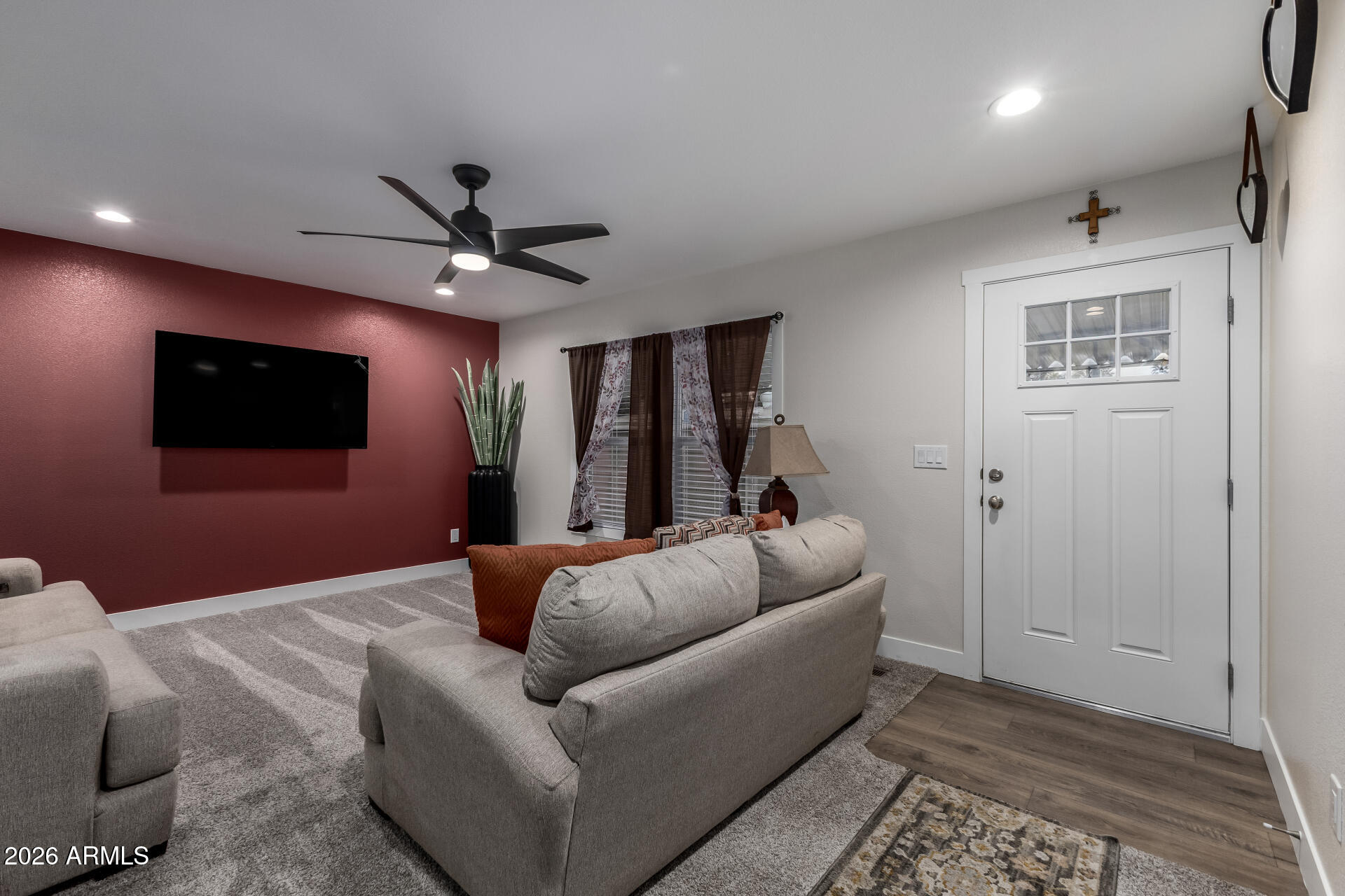 19401 North 7th Street, Unit 73 Phoenix, AZ 85024 - Photo 7 of 30 a living room with furniture and a flat screen tv
