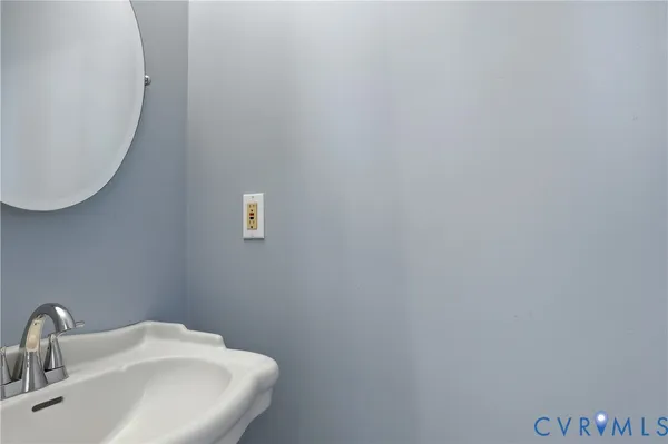 a bathroom with a sink and mirror