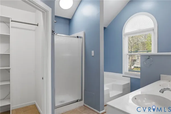 a bathroom with a sink a mirror and a bathtub