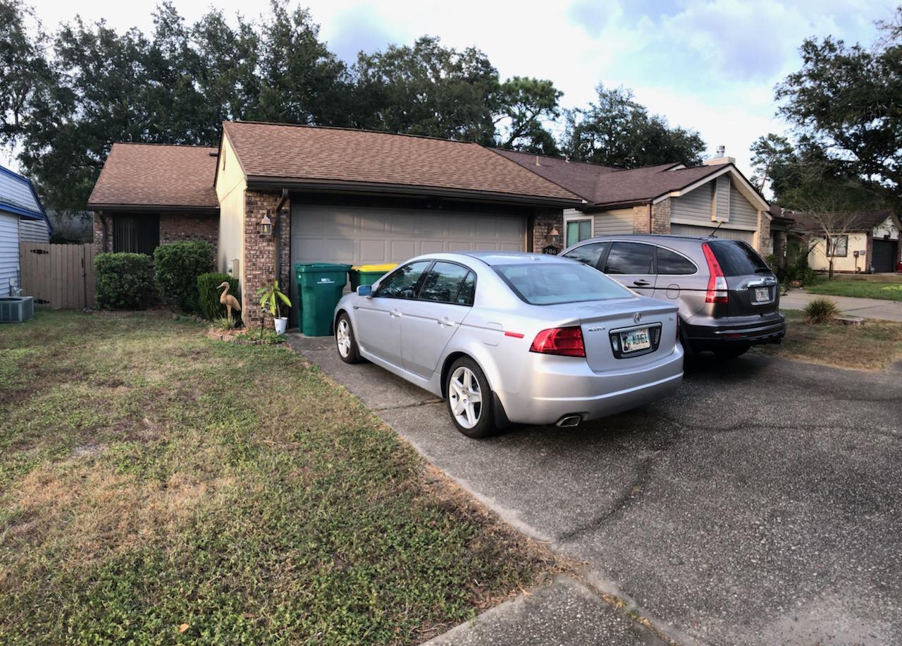 206 Cedar Ridge Way Niceville, FL 32578 - Photo 1 of 12 a car parked in front of a house