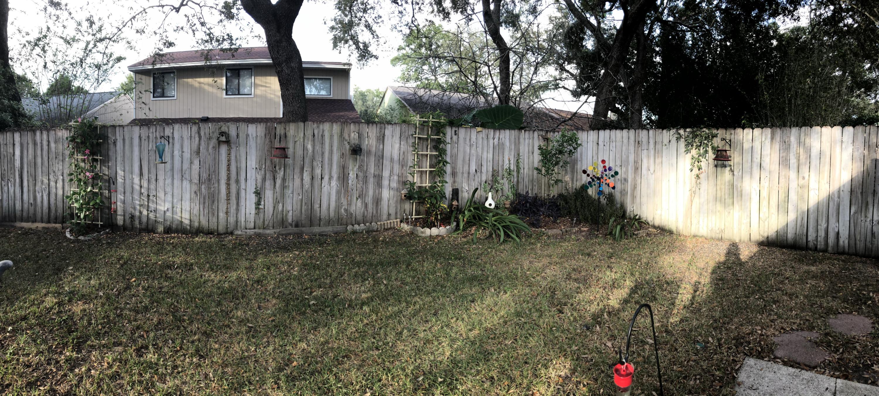 206 Cedar Ridge Way Niceville, FL 32578 - Photo 11 of 12 a view of backyard with potted plants and a large tree