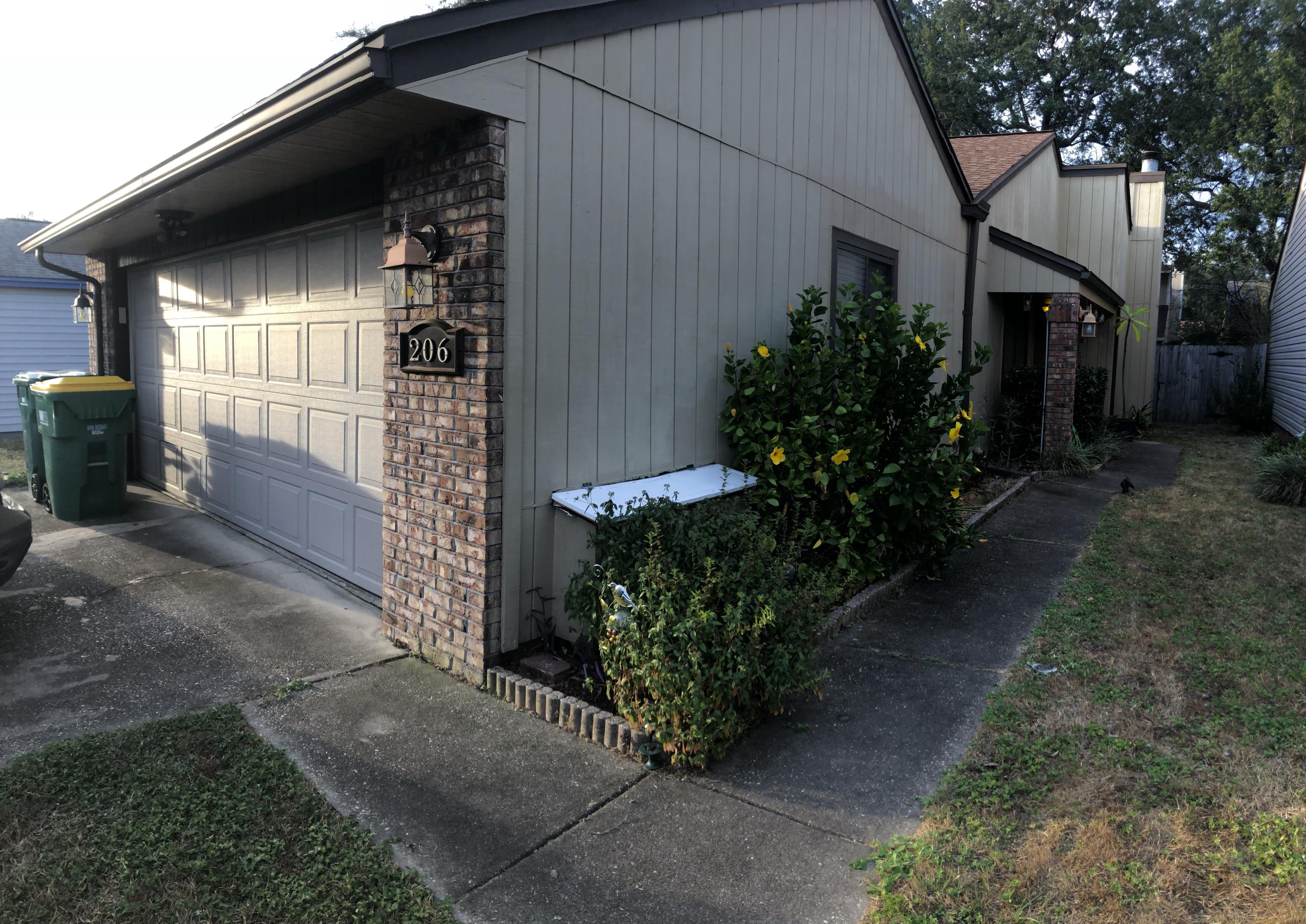 206 Cedar Ridge Way Niceville, FL 32578 - Photo 2 of 12 a yellow house with outdoor space