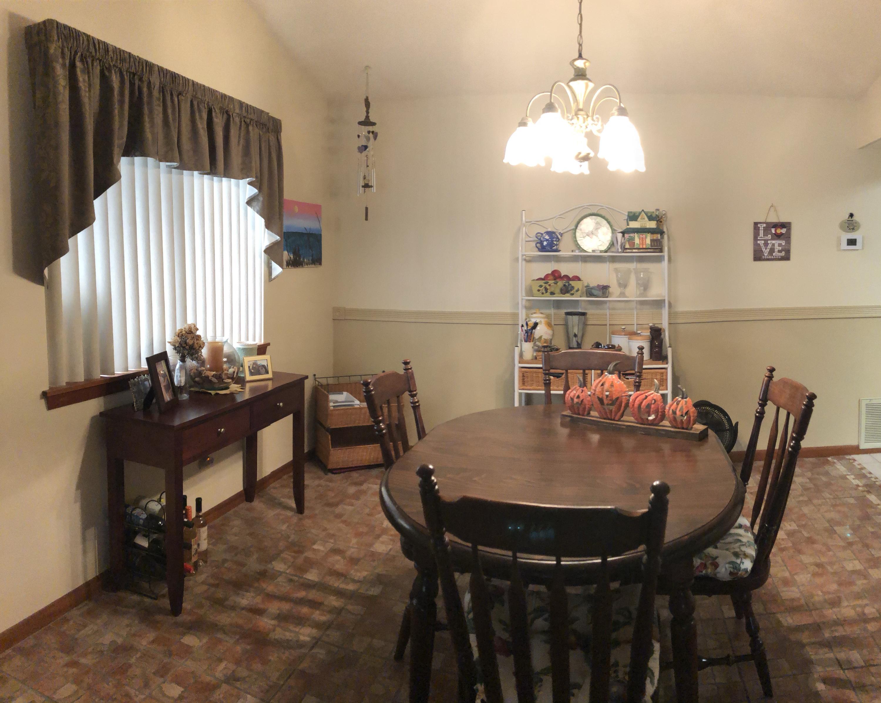206 Cedar Ridge Way Niceville, FL 32578 - Photo 7 of 12 a view of a dining room with furniture and chandelier