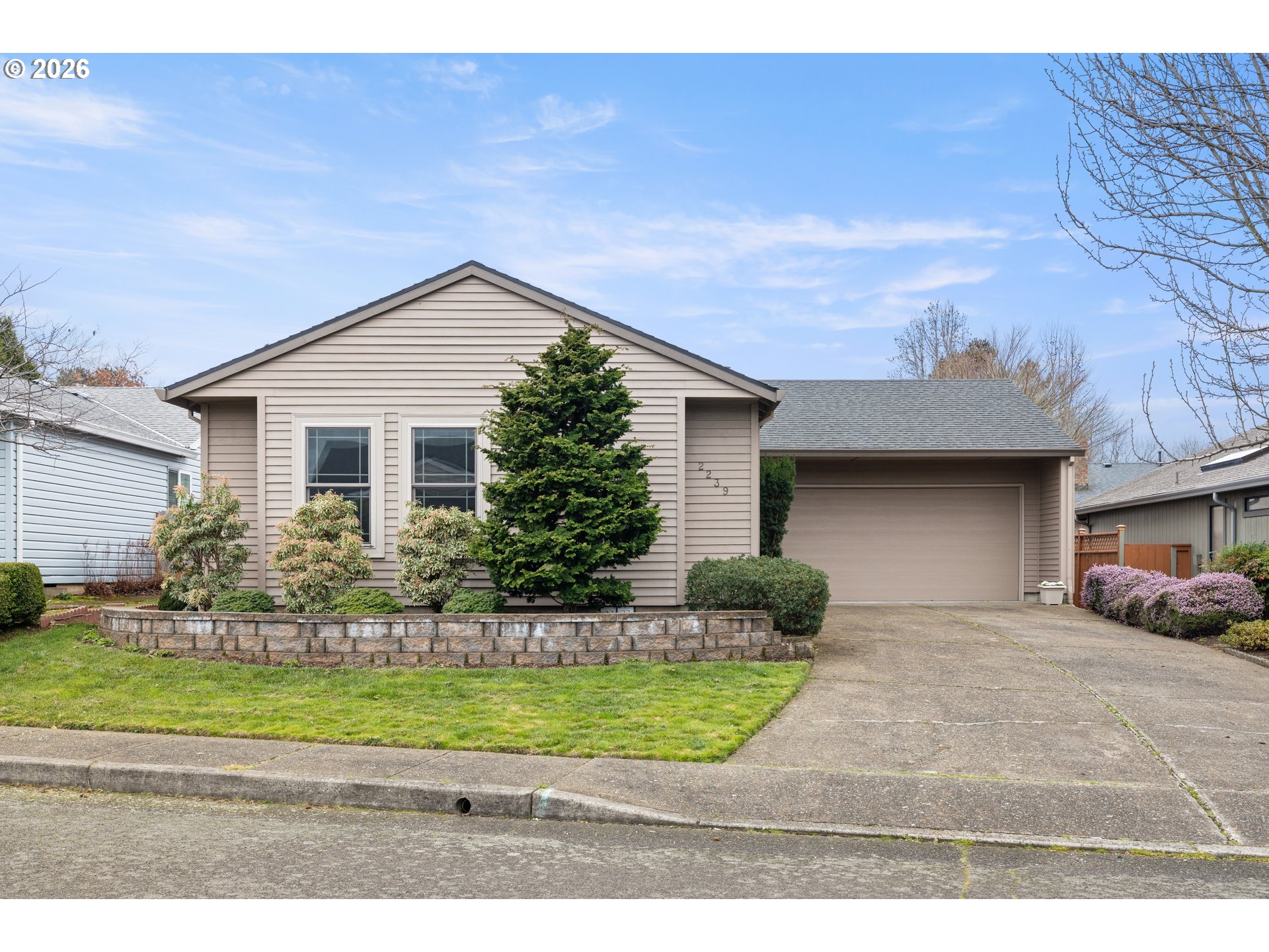 2239 Northeast 153rd Avenue Portland, OR 97230 - Photo 1 of 32 a front view of a house with a yard