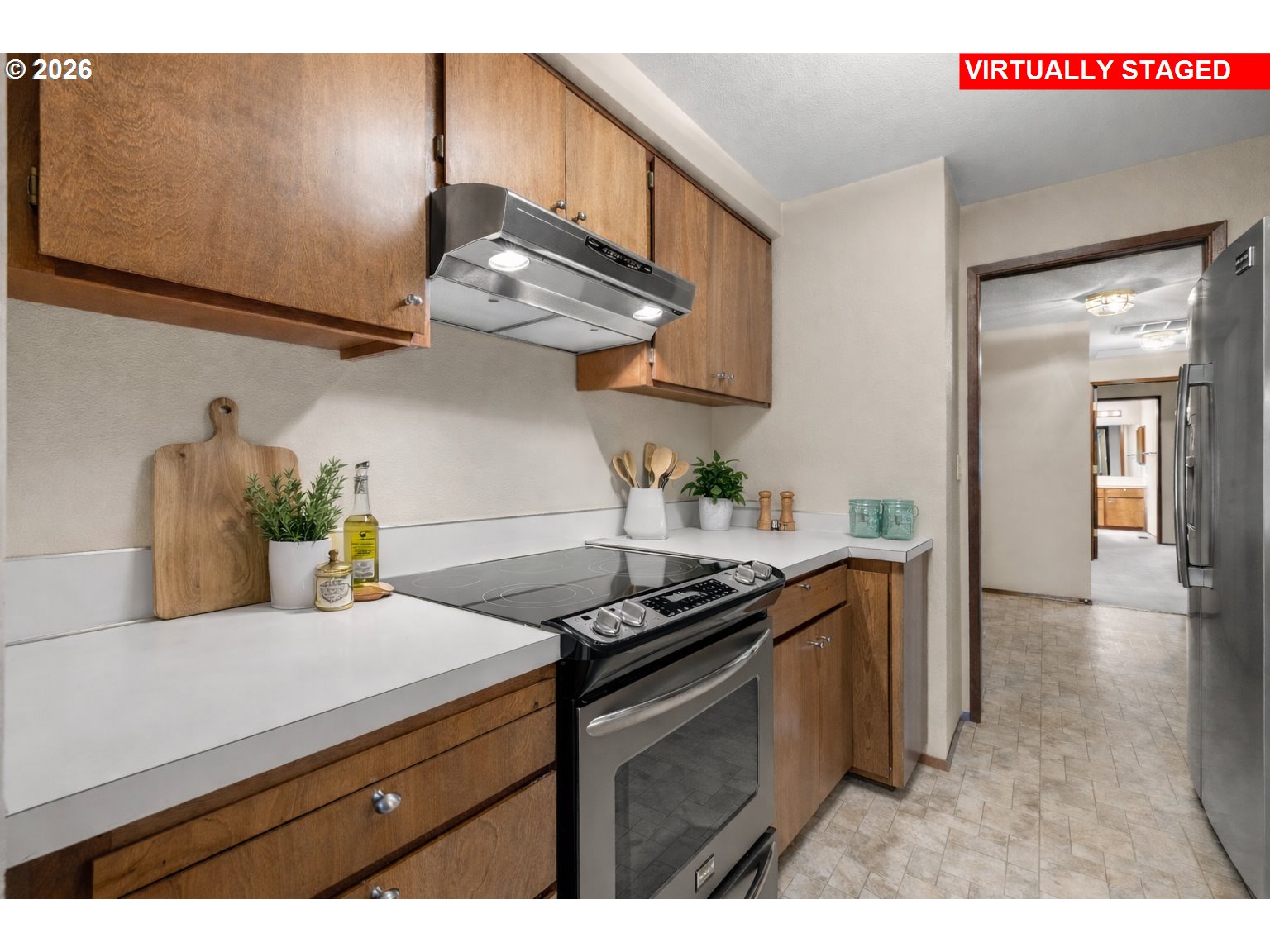 2239 Northeast 153rd Avenue Portland, OR 97230 - Photo 11 of 32 a kitchen with stainless steel appliances granite countertop a sink a stove and a refrigerator
