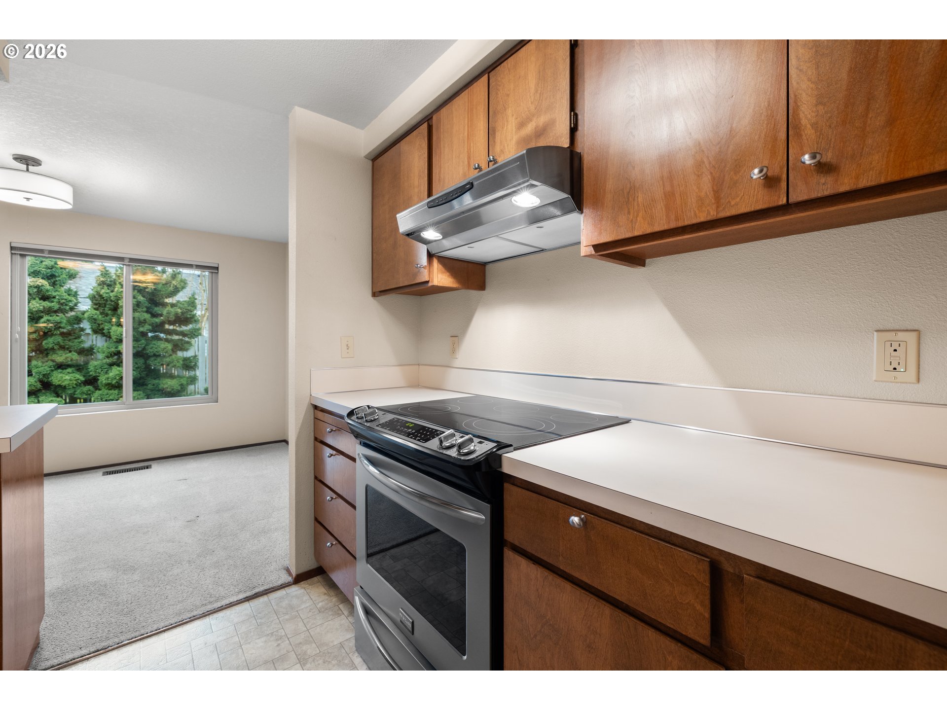 2239 Northeast 153rd Avenue Portland, OR 97230 - Photo 13 of 32 a kitchen with a stove and a microwave