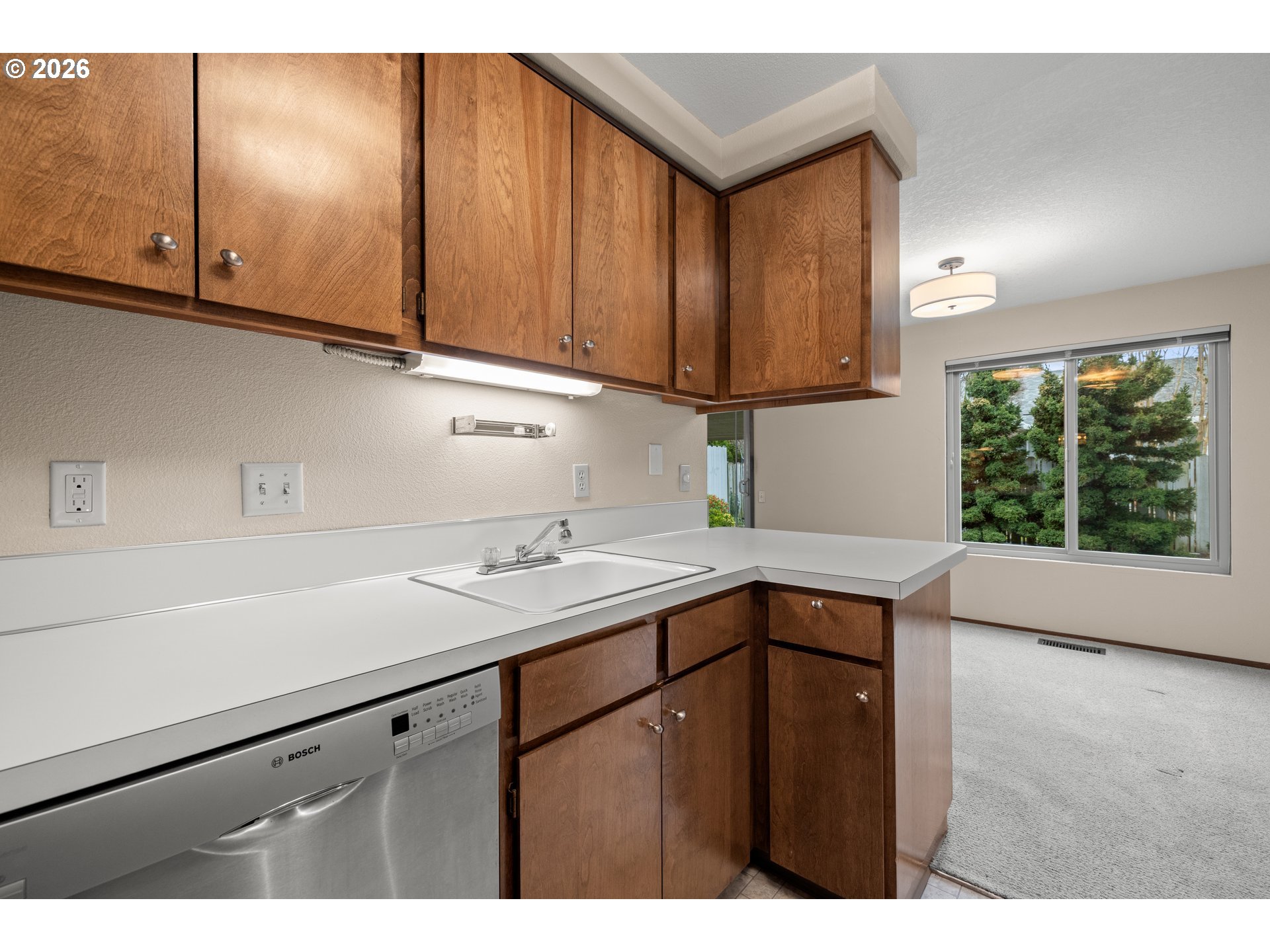 2239 Northeast 153rd Avenue Portland, OR 97230 - Photo 15 of 32 a kitchen with a sink cabinets and a window