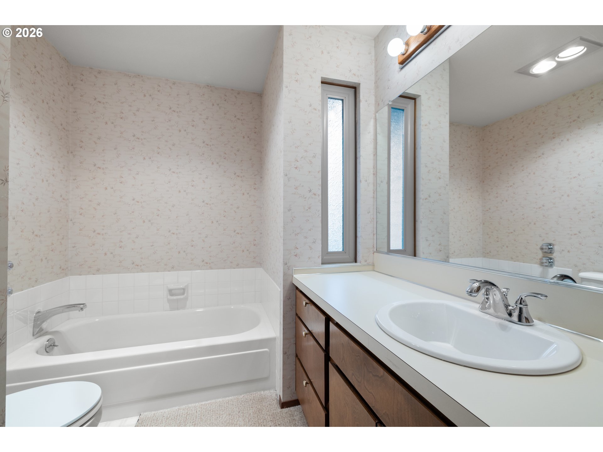 2239 Northeast 153rd Avenue Portland, OR 97230 - Photo 19 of 32 a bathroom with a sink and a bathtub