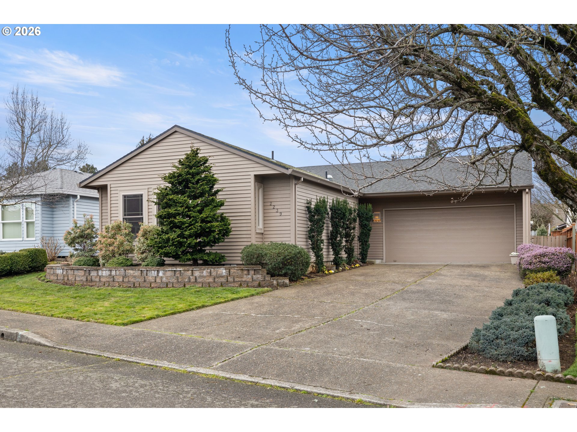2239 Northeast 153rd Avenue Portland, OR 97230 - Photo 2 of 32 a front view of a house with a yard
