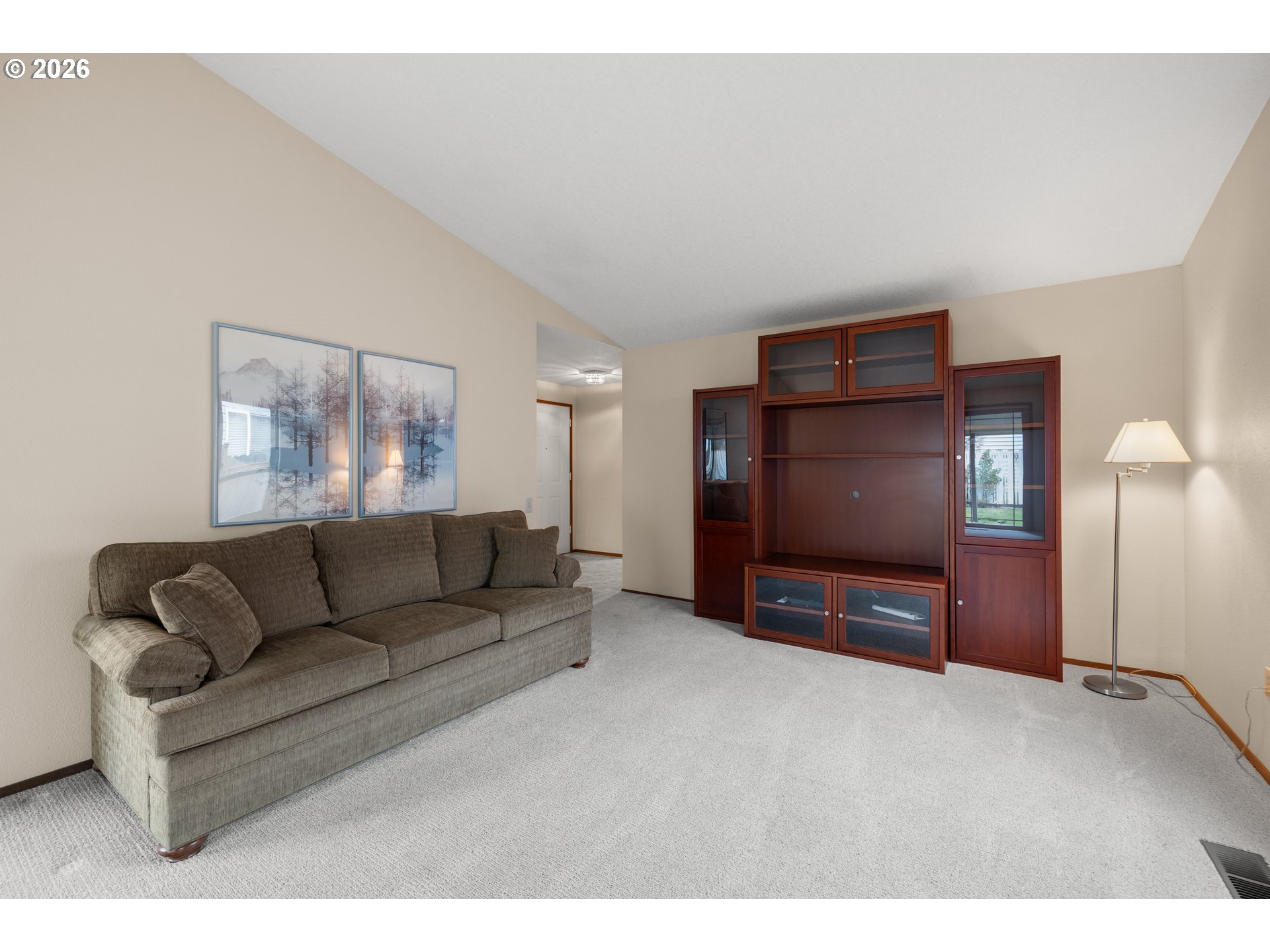 2239 Northeast 153rd Avenue Portland, OR 97230 - Photo 5 of 32 a living room with furniture and a flat screen tv