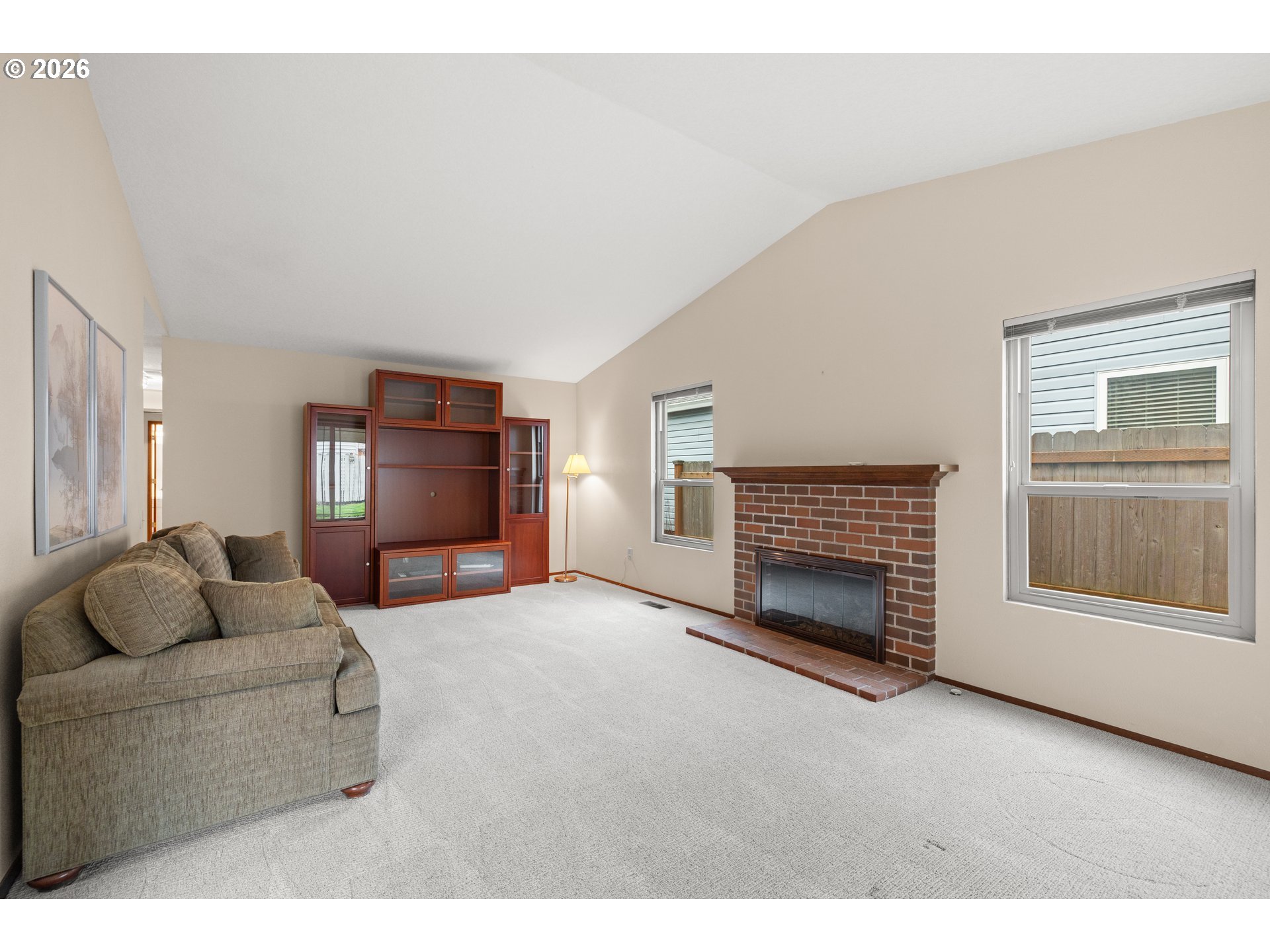 2239 Northeast 153rd Avenue Portland, OR 97230 - Photo 6 of 32 a living room with furniture and a fireplace