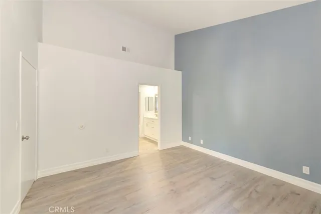 a bathroom with a bathtub shower sink vanity and toilet