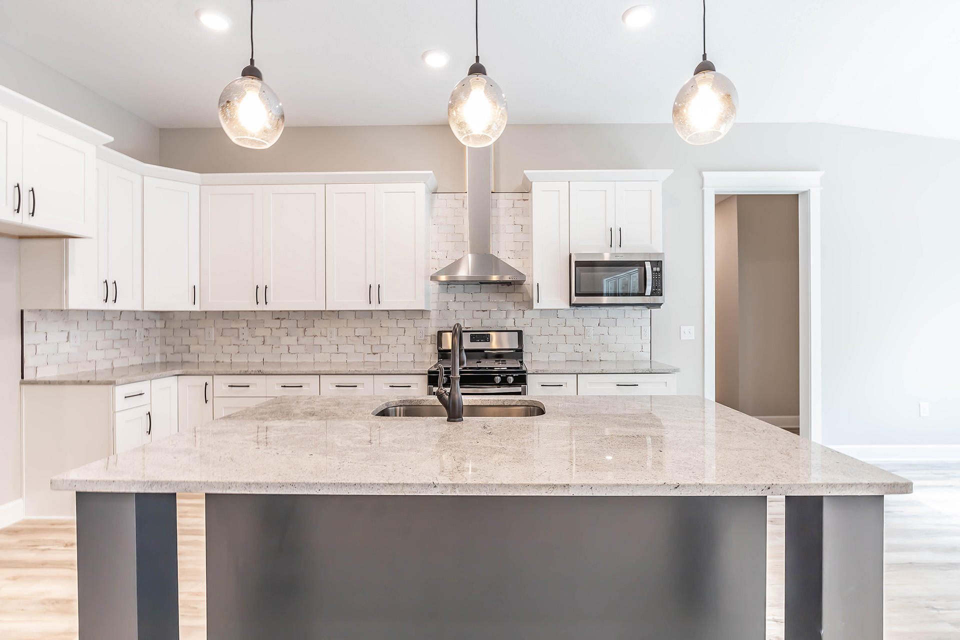 5155 Griffith Mill Road Holt, FL 32564 - Photo 17 of 56 a kitchen with stainless steel appliances granite countertop a sink a stove and a refrigerator