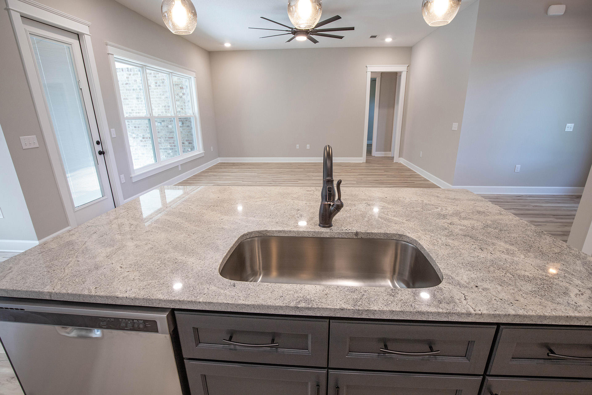 5155 Griffith Mill Road Holt, FL 32564 - Photo 18 of 56 a kitchen with a sink and chandelier
