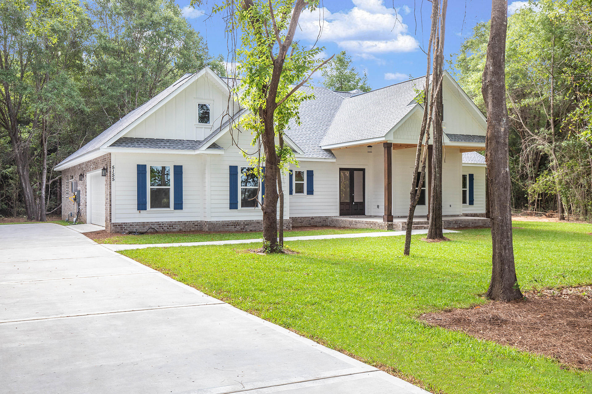 5155 Griffith Mill Road Holt, FL 32564 - Photo 3 of 56 a house view with swimming pool and view of a backyard