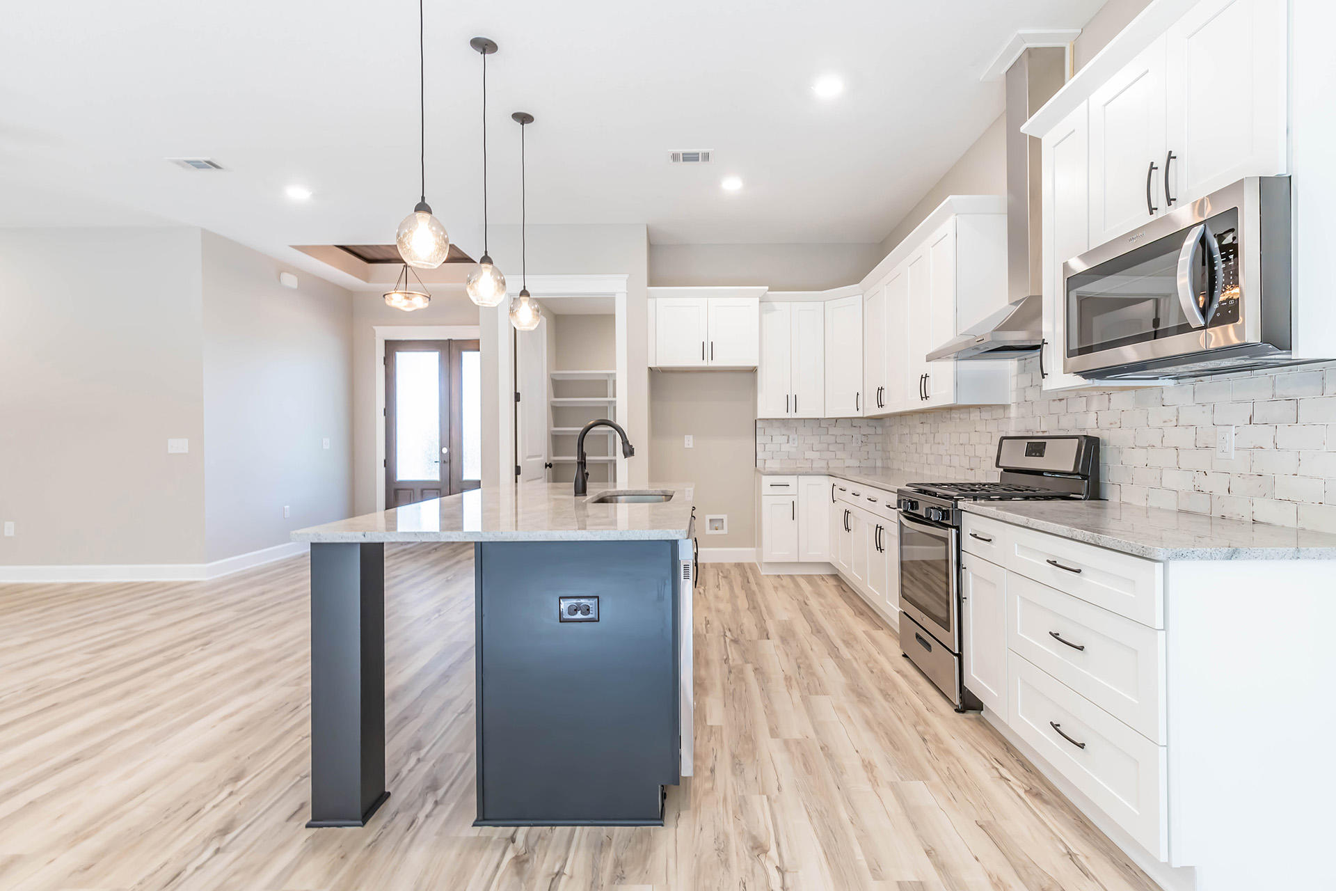 5155 Griffith Mill Road Holt, FL 32564 - Photo 24 of 56 a kitchen with stainless steel appliances granite countertop a sink stove and refrigerator