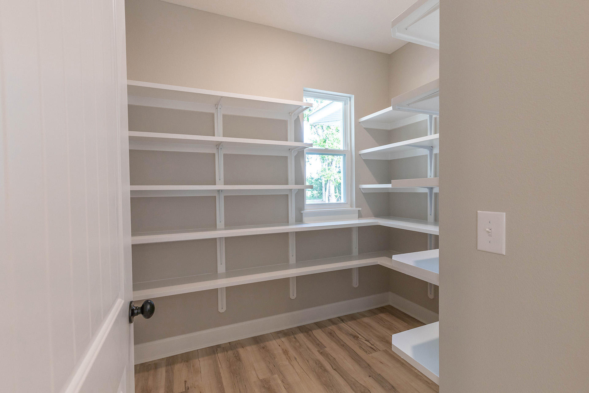 5155 Griffith Mill Road Holt, FL 32564 - Photo 25 of 56 a view of walk in closet with empty racks
