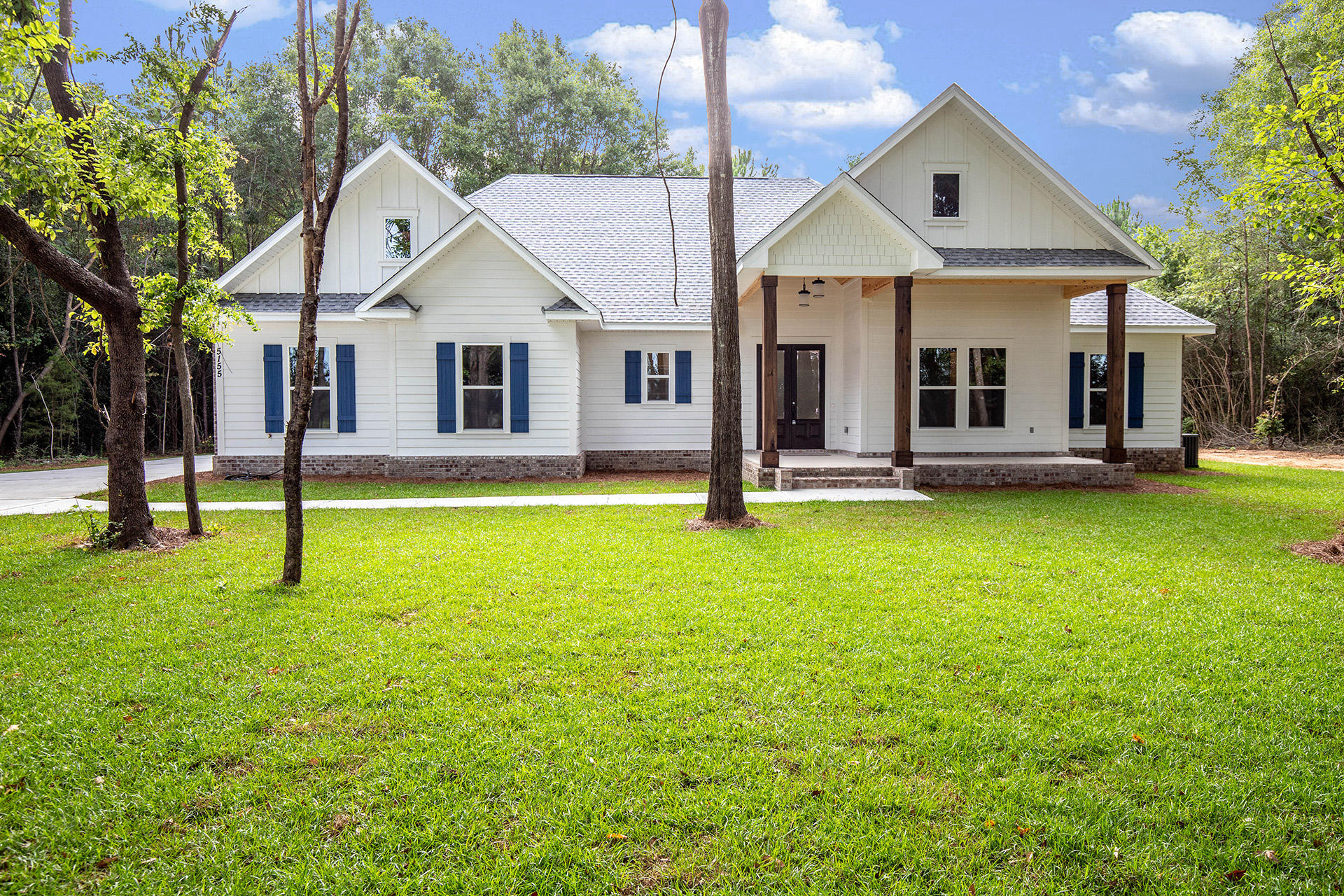 5155 Griffith Mill Road Holt, FL 32564 - Photo 4 of 56 a front view of a house with a yard