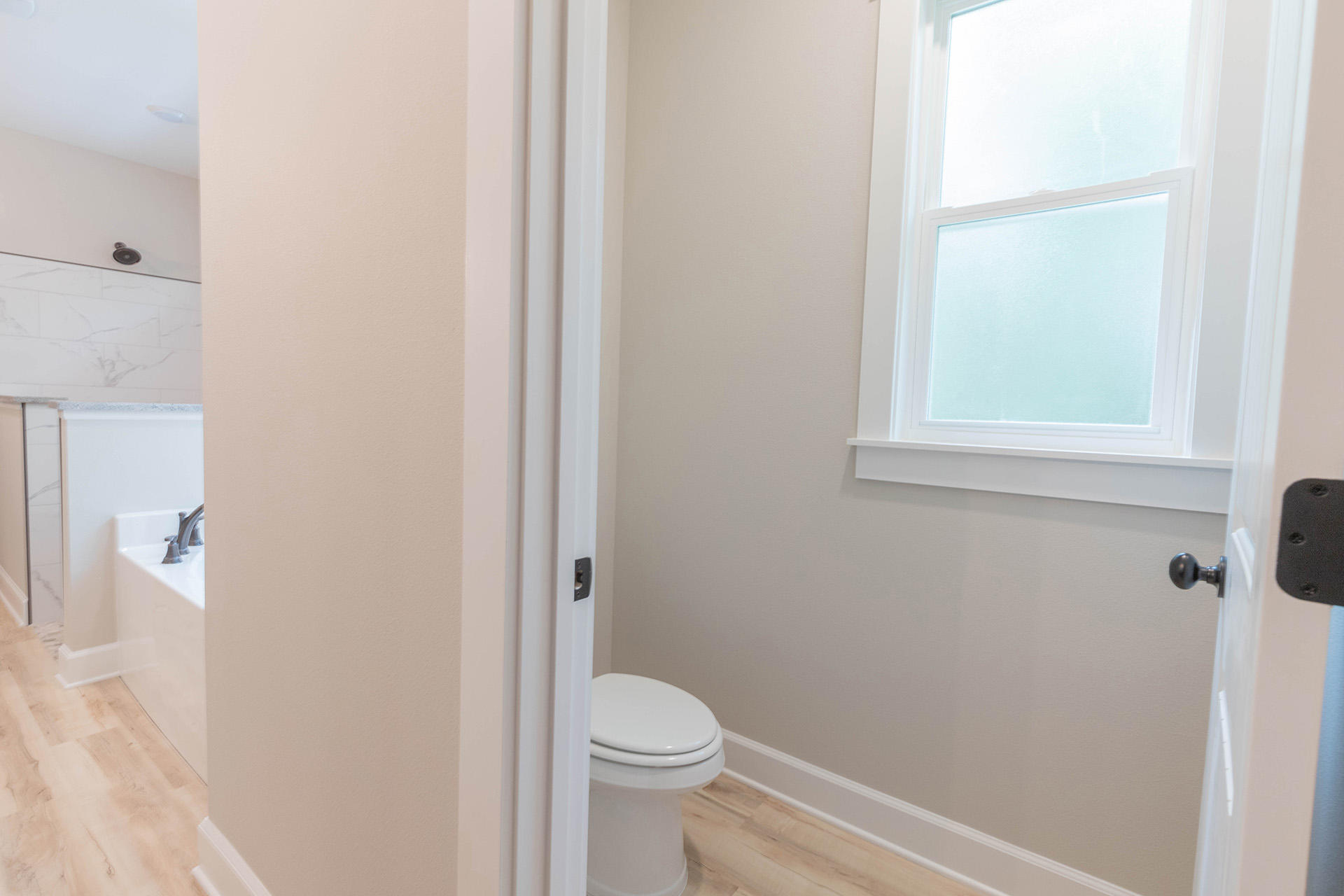 5155 Griffith Mill Road Holt, FL 32564 - Photo 37 of 56 a white toilet sitting next to a bathroom sink