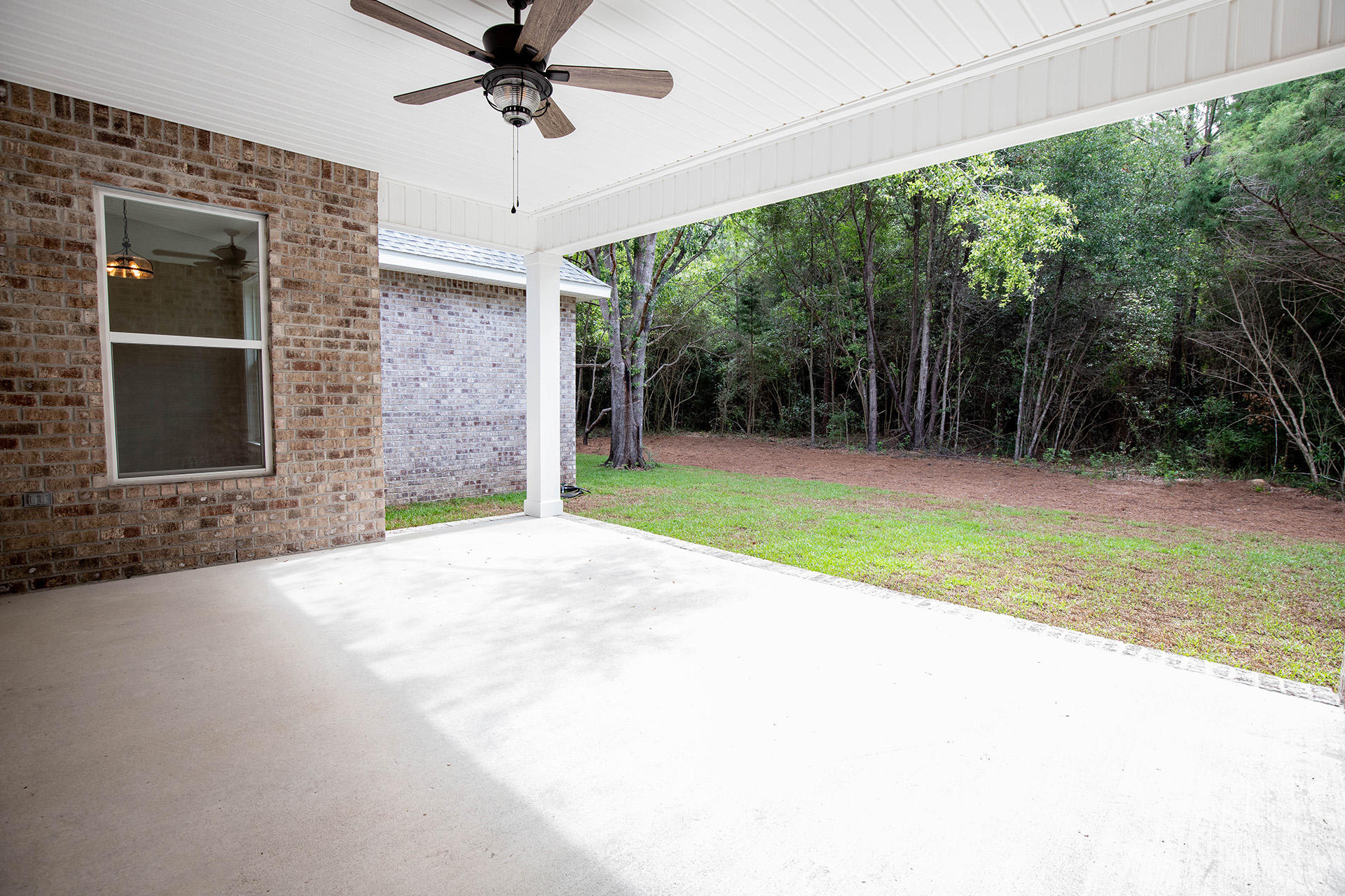 5155 Griffith Mill Road Holt, FL 32564 - Photo 49 of 56 a view of a backyard with a garden and plants