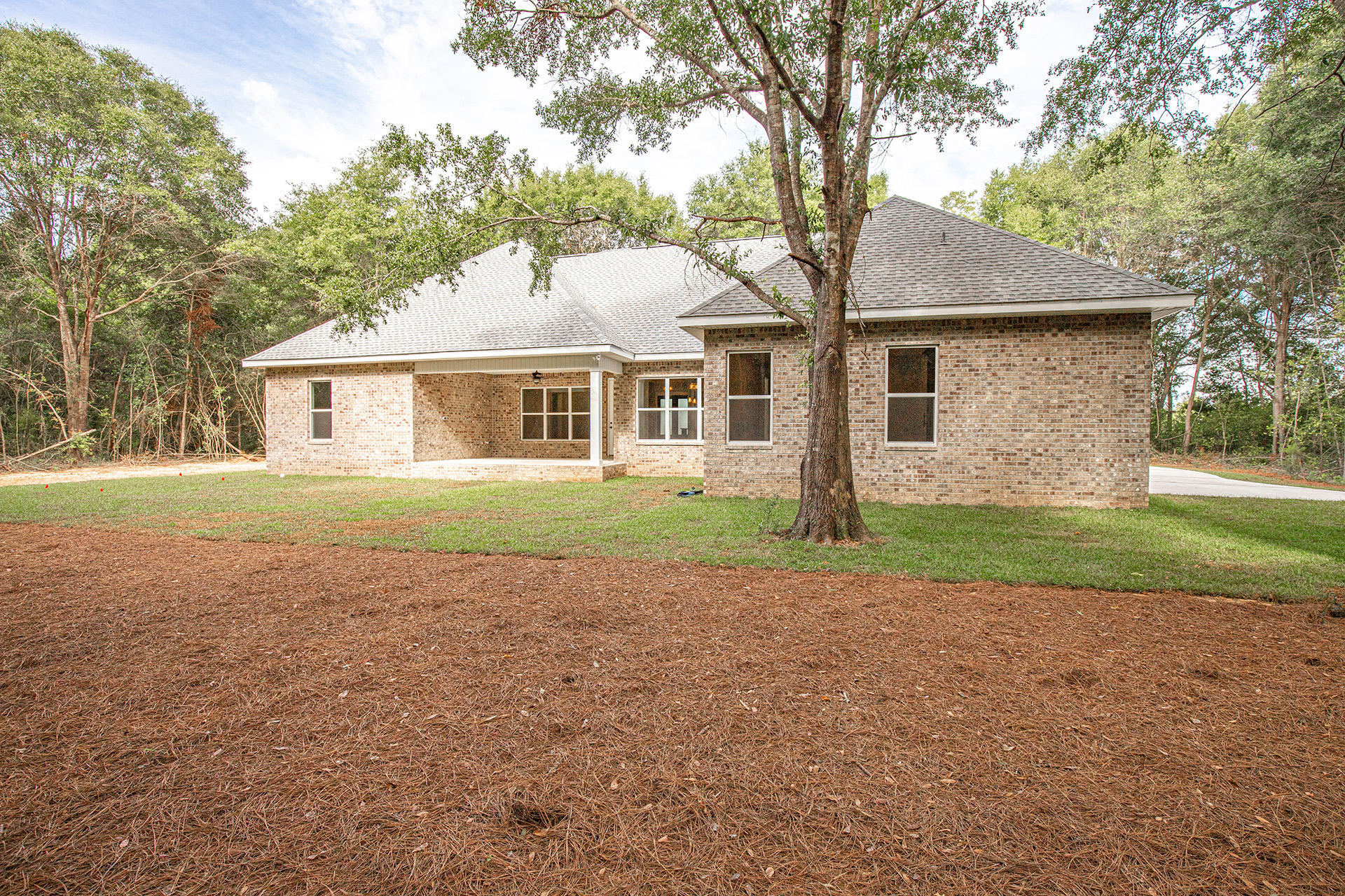 5155 Griffith Mill Road Holt, FL 32564 - Photo 52 of 56 a front view of house with yard and green space