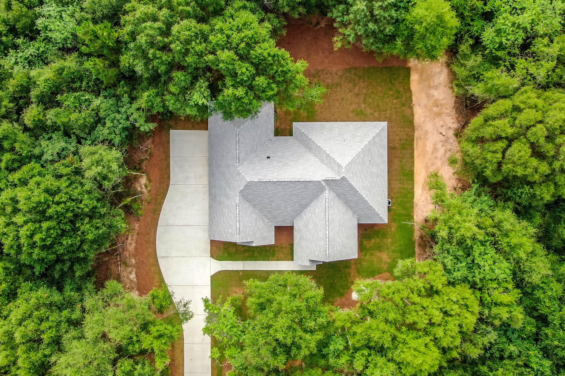 5155 Griffith Mill Road Holt, FL 32564 - Photo 55 of 56 an aerial view of a house with a yard and trees