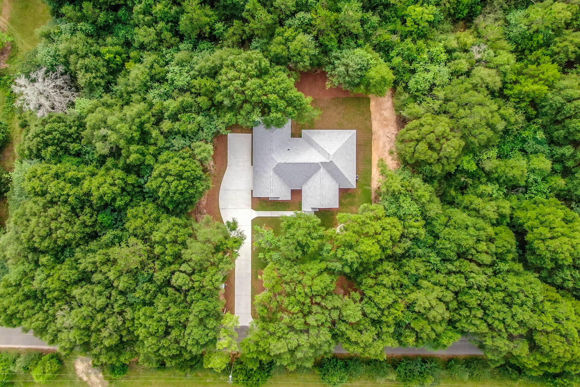5155 Griffith Mill Road Holt, FL 32564 - Photo 56 of 56 an aerial view of a house with a yard