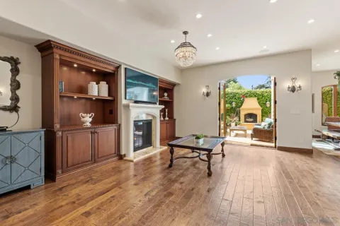 a kitchen with stainless steel appliances granite countertop a sink and a refrigerator