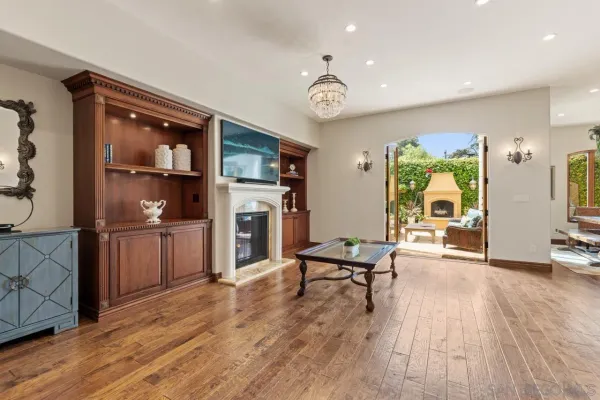 a spacious bedroom with a bed and a lamp