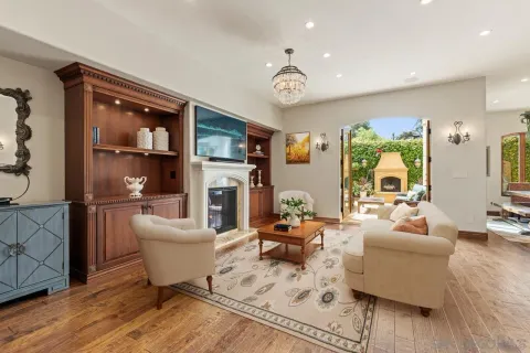 a kitchen with stainless steel appliances granite countertop a sink a stove and a wooden floors