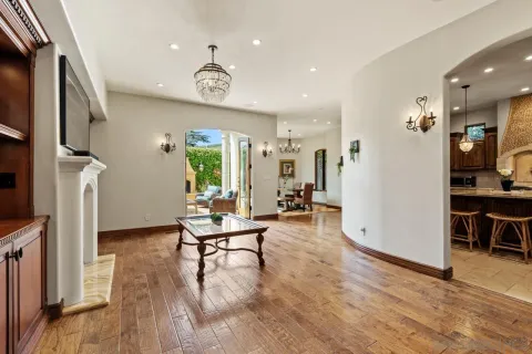 a kitchen with granite countertop a stove sink and cabinets