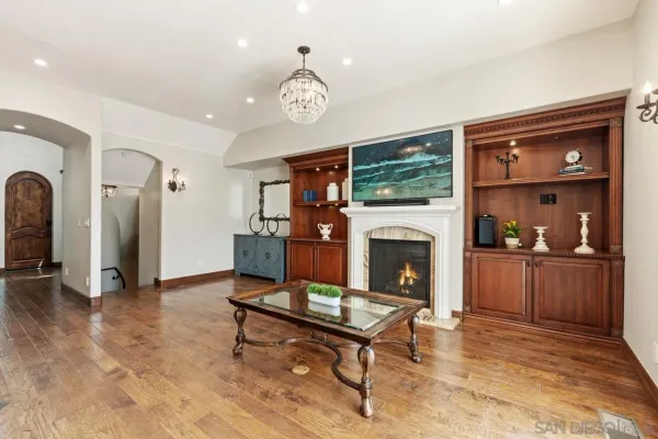 a large bed sitting in a bedroom next to a window